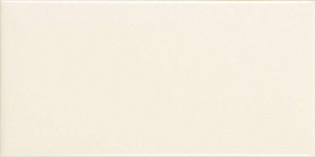 Bevel Metro Hueso 10x20 gloss wall tile by The Tile Collection, featuring a sleek, textured beige finish for modern interiors.